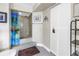 Bathroom featuring a tiled shower with tropical curtain, and white cabinet for optimal storage at 6011 Bahia Del Mar Blvd # 158, St Petersburg, FL 33715