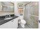 Bathroom featuring granite countertops, a vanity, a toilet, and a glass-enclosed shower at 6011 Bahia Del Mar Blvd # 158, St Petersburg, FL 33715
