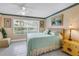 Cozy bedroom with a large window, tile flooring, and neutral décor at 6011 Bahia Del Mar Blvd # 158, St Petersburg, FL 33715