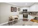Charming eat-in kitchen featuring white cabinets, granite countertops, and stainless steel appliances at 6011 Bahia Del Mar Blvd # 158, St Petersburg, FL 33715