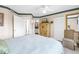 Relaxing bedroom with a ceiling fan, neutral walls, and access to a bathroom and closet at 6011 Bahia Del Mar Blvd # 158, St Petersburg, FL 33715