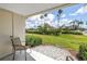 Patio area overlooking a grassy area with trees and lush landscaping. Perfect for outdoor enjoyment at 6011 Bahia Del Mar Blvd # 158, St Petersburg, FL 33715