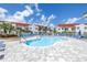 Resort-style pool area with blue lounge chairs surrounding a large pool, perfect for relaxation at 6011 Bahia Del Mar Blvd # 158, St Petersburg, FL 33715