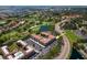 Aerial view of condo complex with a golf course, lake, and parking at 6150 Gulfport S Blvd # 306, Gulfport, FL 33707