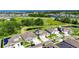Aerial view of the home, showcasing its premium location, surrounding greenery, and pond views at 6253 Hidden Branch Dr, Apollo Beach, FL 33572