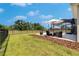Spacious backyard featuring a patio and well-maintained lawn, perfect for outdoor activities at 6253 Hidden Branch Dr, Apollo Beach, FL 33572