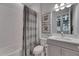 This bathroom includes a combination shower and tub, as well as an updated vanity with a marble countertop at 6253 Hidden Branch Dr, Apollo Beach, FL 33572