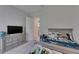 This bedroom is carpeted, includes a dresser and side table, and is decorated with a Star Wars theme at 6253 Hidden Branch Dr, Apollo Beach, FL 33572