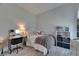 Comfortable bedroom with plush gray carpet, desk and chair, and plenty of storage at 6253 Hidden Branch Dr, Apollo Beach, FL 33572