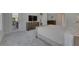 Comfortable bedroom featuring carpet and an ensuite bathroom, providing a private retreat at 6253 Hidden Branch Dr, Apollo Beach, FL 33572