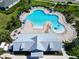 Aerial view of the resort-style pool, sun deck, playground and clubhouse enhance this community's appeal at 6253 Hidden Branch Dr, Apollo Beach, FL 33572