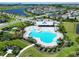 A beautiful aerial view showcases the resort-style pool, clubhouse, and surrounding amenities in this community at 6253 Hidden Branch Dr, Apollo Beach, FL 33572