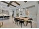 Open concept dining area featuring a wooden table, black chairs, and sight lines to the kitchen at 6253 Hidden Branch Dr, Apollo Beach, FL 33572