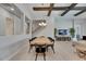 Elegant dining area with a wood table, black chairs, and views into the living room at 6253 Hidden Branch Dr, Apollo Beach, FL 33572