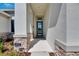 Elegant entrance with stone accents and stylish front door at 6253 Hidden Branch Dr, Apollo Beach, FL 33572