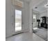 Foyer featuring a modern door and views to a room with neutral tones at 6253 Hidden Branch Dr, Apollo Beach, FL 33572