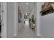 Spacious hallway leads to an open-concept living area, with modern decor, and natural light creating an inviting atmosphere at 6253 Hidden Branch Dr, Apollo Beach, FL 33572