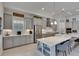 Modern kitchen with stainless steel appliances, quartz countertops, and an island with seating at 6253 Hidden Branch Dr, Apollo Beach, FL 33572