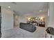 Comfortable upstairs living room features plush gray carpet at 6253 Hidden Branch Dr, Apollo Beach, FL 33572
