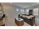 Upstairs living room is well lit and decorated with contemporary decor at 6253 Hidden Branch Dr, Apollo Beach, FL 33572