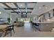Open-concept living space showcasing a kitchen, dining area, and a living room with seamless indoor-outdoor living at 6253 Hidden Branch Dr, Apollo Beach, FL 33572