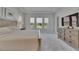 This carpeted primary bedroom features plenty of natural light and includes a view of the backyard at 6253 Hidden Branch Dr, Apollo Beach, FL 33572