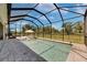 A covered, screened pool with loungers and a lounge area, offering a perfect outdoor living space at 6253 Hidden Branch Dr, Apollo Beach, FL 33572