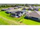 Aerial view showcasing a backyard with a pool and solar panels at 6253 Hidden Branch Dr, Apollo Beach, FL 33572