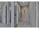 The glass-enclosed shower is tiled and features a built-in bench and shampoo nook at 6253 Hidden Branch Dr, Apollo Beach, FL 33572