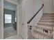 Carpeted staircase with safety gate leading to the upper level at 6253 Hidden Branch Dr, Apollo Beach, FL 33572