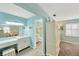Bathroom with blue walls, double vanity and a walk-in shower at 701 Millifold Pl, Brandon, FL 33510