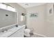 Neutral half bath with marble countertop vanity and framed mirror at 701 Millifold Pl, Brandon, FL 33510