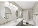 Bathroom featuring dual sinks with modern fixtures and shower with gray and white tiling at 701 Millifold Pl, Brandon, FL 33510