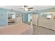 Light-filled bedroom with turquoise walls and matching decor at 701 Millifold Pl, Brandon, FL 33510