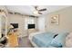 Comfortable bedroom with a bed, desk, and natural light at 701 Millifold Pl, Brandon, FL 33510