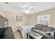 Cozy bedroom with a single bed, comfortable sofa, and natural light at 701 Millifold Pl, Brandon, FL 33510