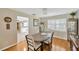 Cozy dining area with hardwood floors and shutters, perfect for intimate gatherings at 701 Millifold Pl, Brandon, FL 33510
