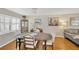 Charming dining area with a wooden table, upholstered chairs, and hardwood floors at 701 Millifold Pl, Brandon, FL 33510