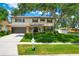 Traditional two-story home featuring a manicured front yard and a charming, welcoming entrance at 701 Millifold Pl, Brandon, FL 33510