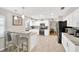 Bright kitchen with stainless steel appliances, light wood floors, and granite countertops at 701 Millifold Pl, Brandon, FL 33510
