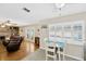 Cozy eat-in area looks into the living room with a fireplace and backyard views at 701 Millifold Pl, Brandon, FL 33510