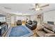 Spacious living room featuring hardwood floors, ceiling fans, and ample seating at 701 Millifold Pl, Brandon, FL 33510