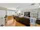 Bright living room with hardwood floors, ceiling fans, and comfortable seating at 701 Millifold Pl, Brandon, FL 33510
