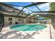 Screened-in pool with a patio area and outdoor seating, perfect for relaxation and entertainment at 701 Millifold Pl, Brandon, FL 33510