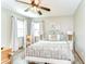 Bedroom showcases decorative bed frame, stylish tile flooring, and an abundance of natural light at 709 Sportsman Park Dr, Seffner, FL 33584