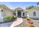 Charming home featuring a landscaped walkway leading to an inviting front entrance at 709 Sportsman Park Dr, Seffner, FL 33584