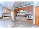 Charming kitchen featuring a brick arch, stainless steel appliances, and custom cabinetry at 709 Sportsman Park Dr, Seffner, FL 33584