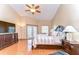 Bright primary bedroom with hardwood floors, high ceilings, and a private balcony at 709 Sportsman Park Dr, Seffner, FL 33584