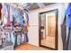 Spacious walk-in closet with custom shelving, hanging racks, and a full-length mirror provides plenty of room for storage at 709 Sportsman Park Dr, Seffner, FL 33584