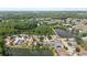 Scenic aerial view of a lakeside community surrounded by lush greenery and multiple ponds at 7235 Sharpsburg Blvd, New Port Richey, FL 34653